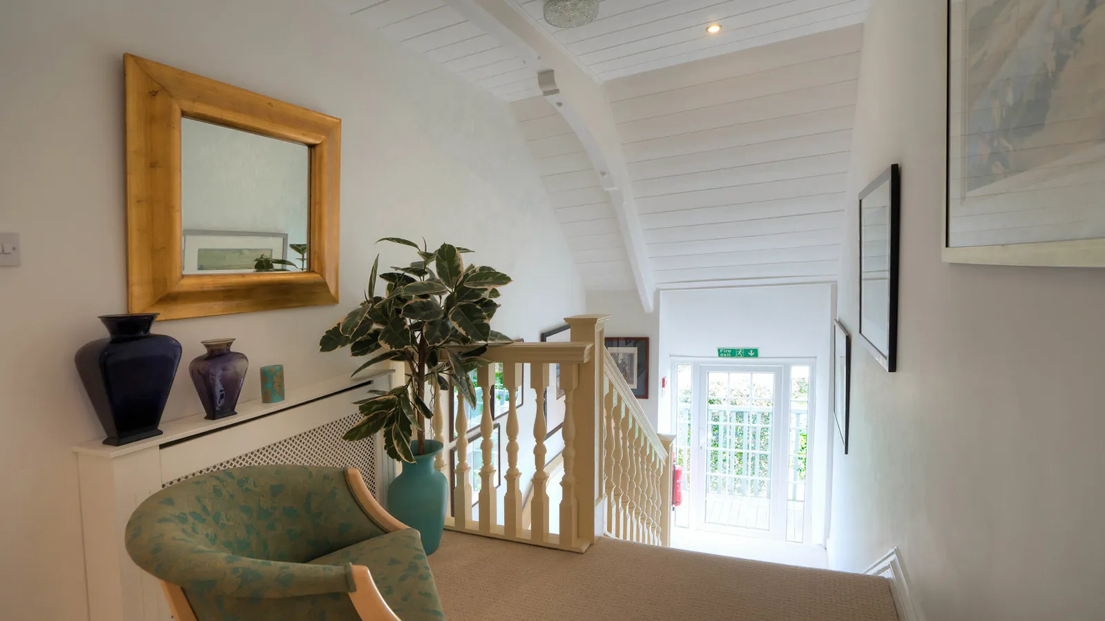 The staircase landing at Higher Faugan Parc, lit by the garden window