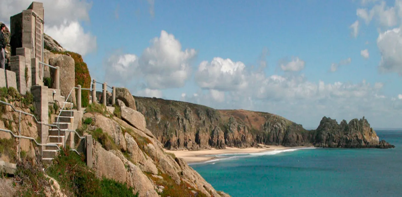 Porthcurno's turquoise water and granite cliffs below the Minack Theatre