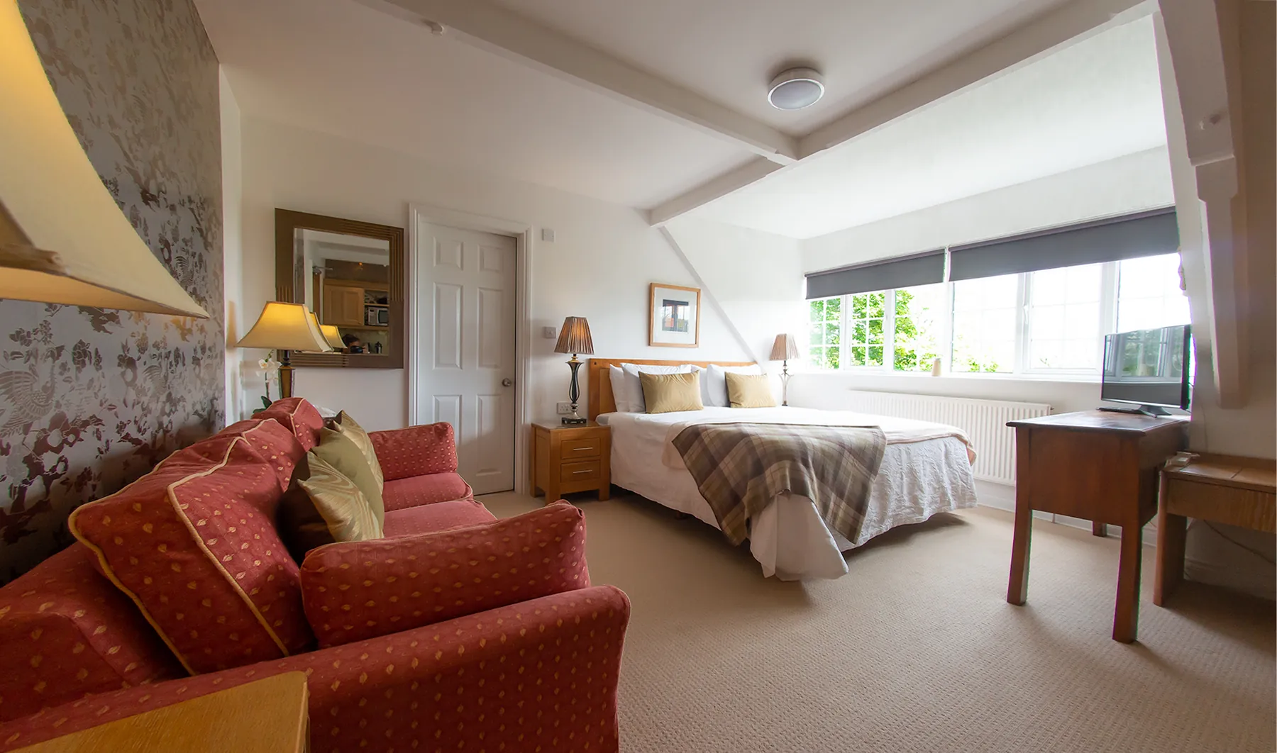 Room 3 at Higher Faugan Parc: seating area and desk beside the window
