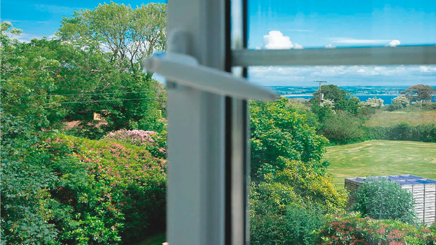 The garden and Mount's Bay view from the window of Room 1 at Higher Faugan Parc