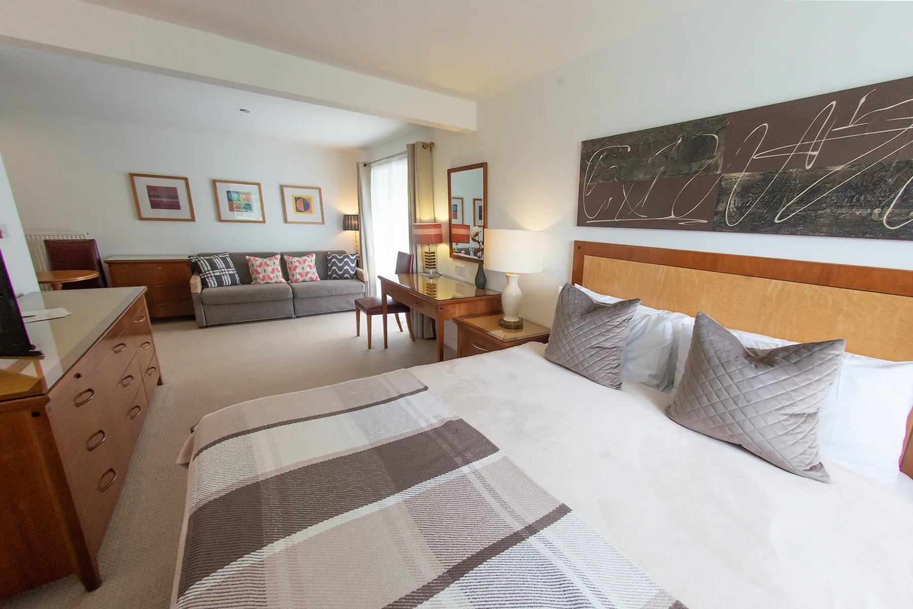 Room 2 at Higher Faugan Parc: bed, chest of drawers and seating