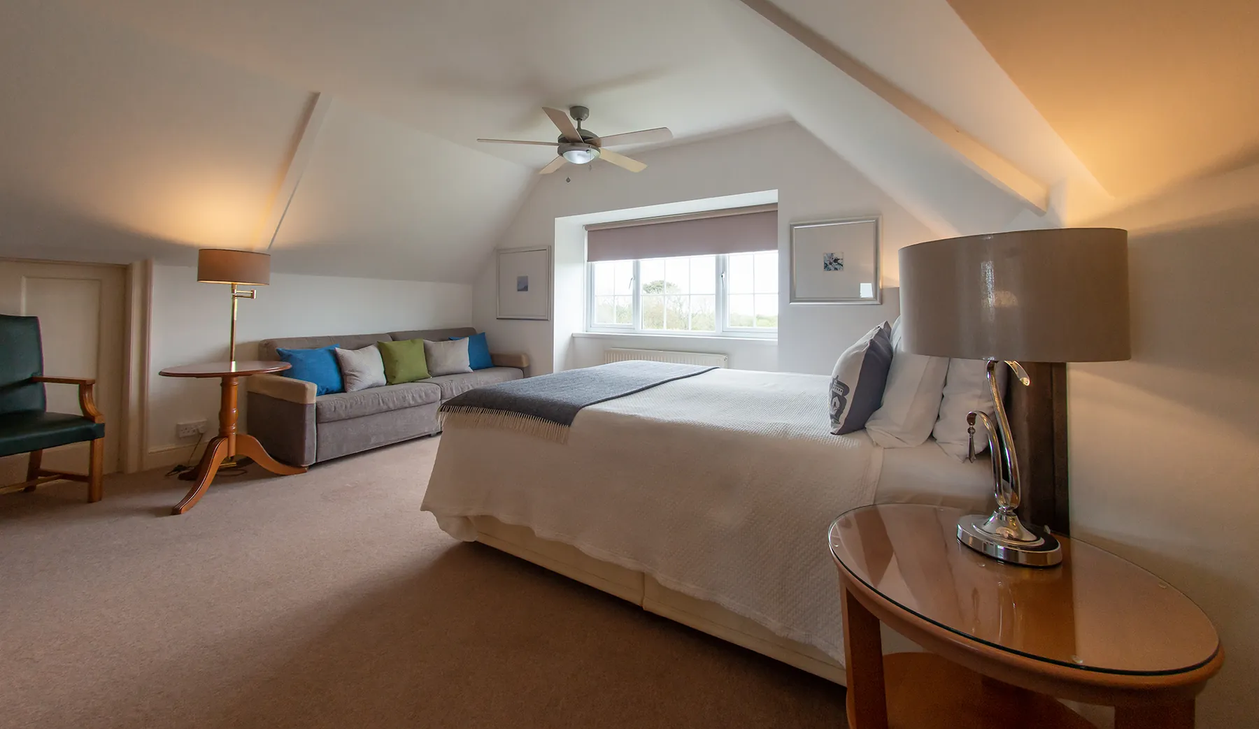 Room 6 at Higher Faugan Parc: the king-size bed and seating in the sunny second-floor room