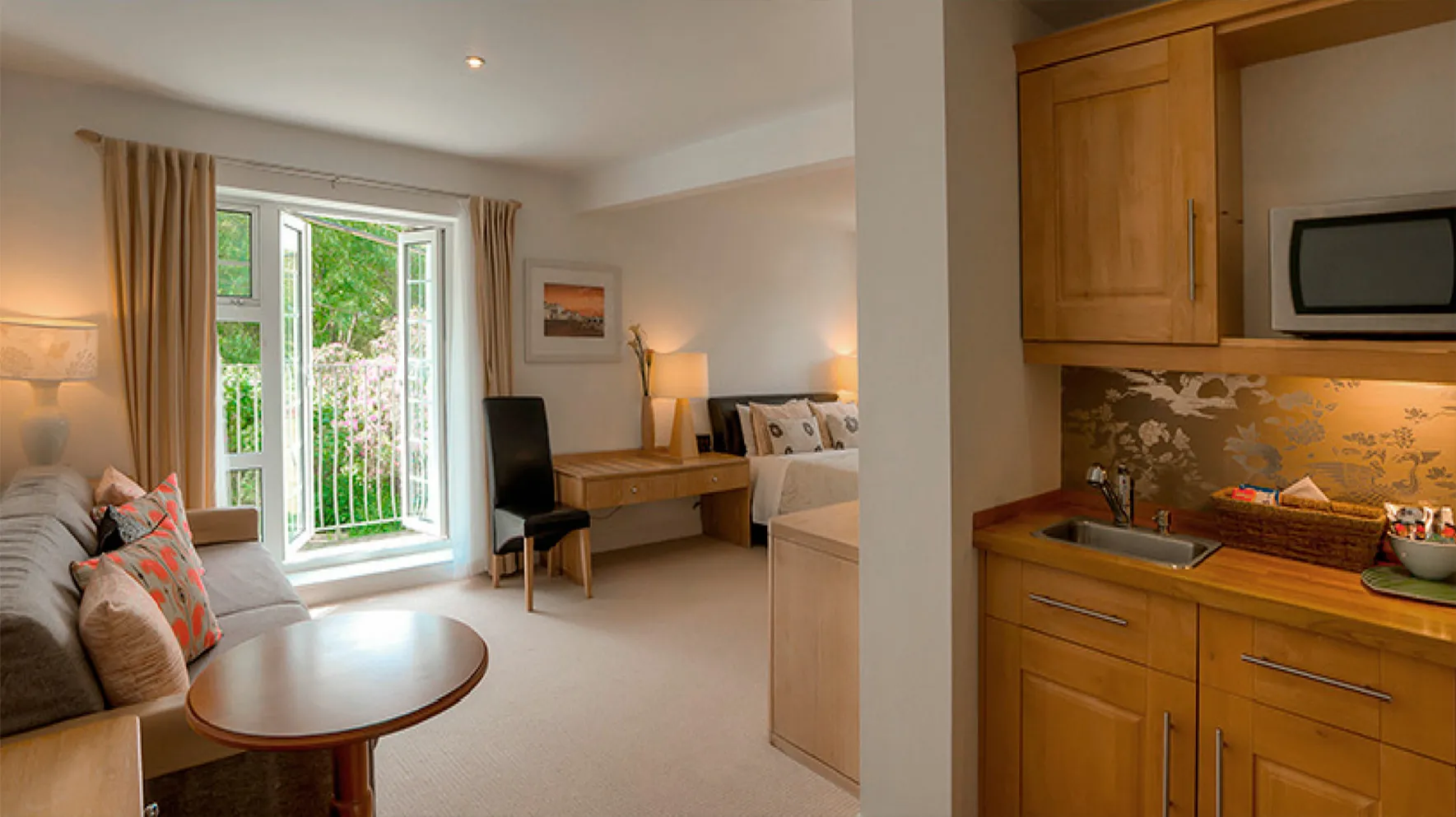 Room 2 at Higher Faugan Parc: the suite with garden doors open to the grounds
