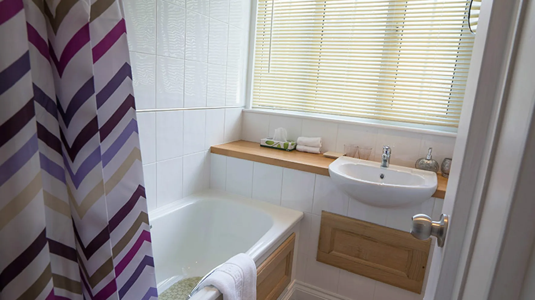 The en-suite bathroom serving Room 4 at Higher Faugan Parc, with bath and shower